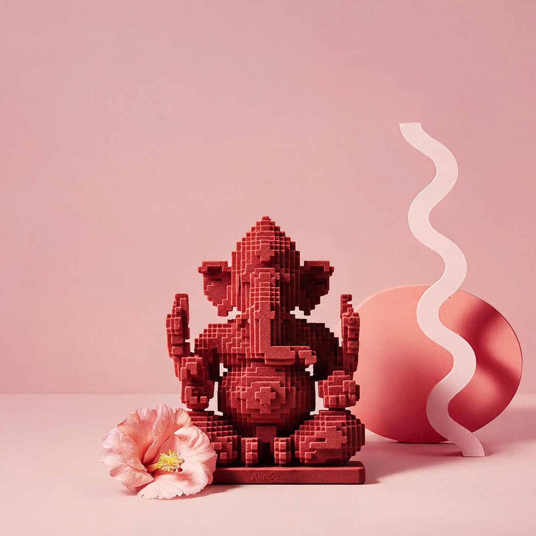 Moh – red AeriQ Pixel Ganpati Ganesha idol on a pink pedestal with a sheer drape