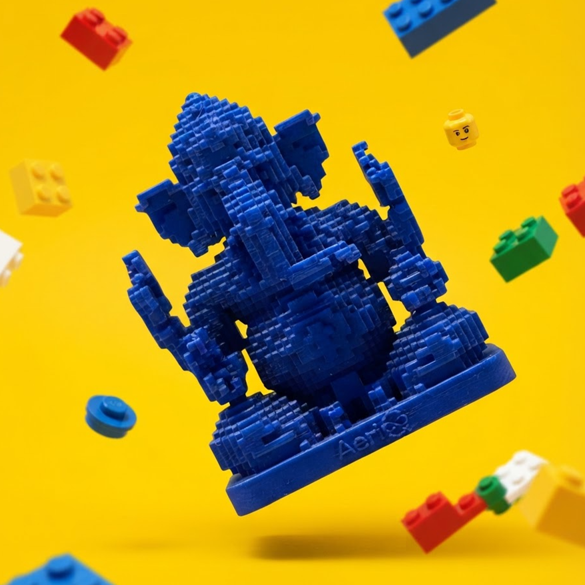 Navy blue AeriQ Pixel Ganpati Ganesha idol with building blocks on yellow